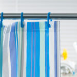 Replace any dirty or worn shower curtains, clean and repair glass shower screens.