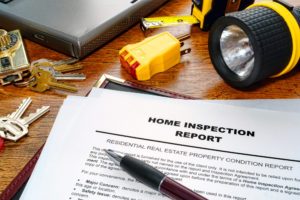 Image of a Inspection Report will tools around it